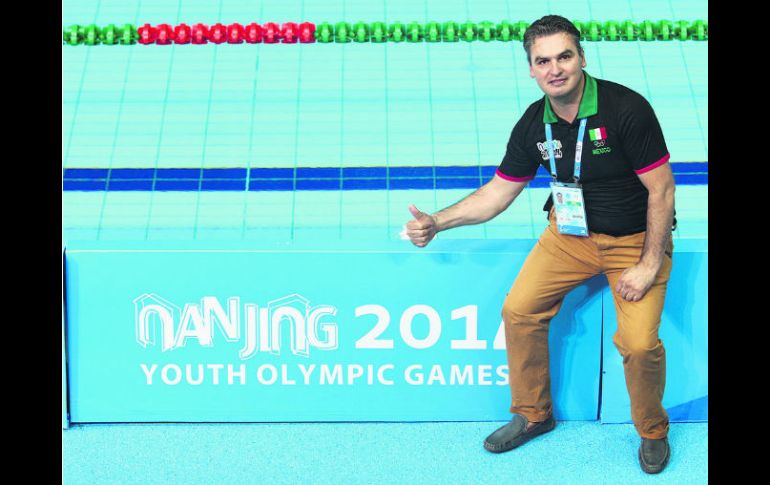 Iván Bautista consiguió que sus pupilos Alejandra Orozco y Rodrigo Diego consiguieran cuatro medallas en Nanjing.  /