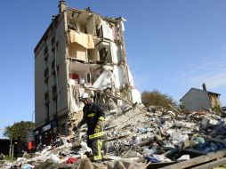 La explosión vuela la fachada del edificio y deja al descubierto el interior de los departamentos. AFP /