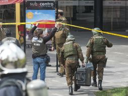Una bomba detona en un local comercia, causando 14 heridos, dos de ellos de gravedad. AFP  V. Rodas  /