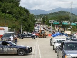 Los cuerpos fueron abandonados en la caja de una camioneta oficial en la carretera México-Acapulco. NTX  ARCHIVO  /
