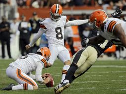 Billy Cundiff (c) consiguió un gol de campo de 29 yardas a tres segundos del final. AP  T. Dejak.  /