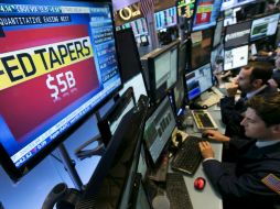 El selectivo S&P 500 y el índice compuesto Nasdaq también se mostraron al alza. AP   R.Drew.  /