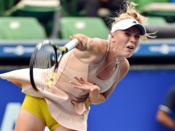 Caroline logró su pase al vencer a la española Carla Suárez. AFP K. Nogi  /