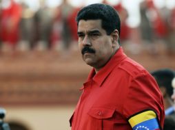 El mandatario promulga una ley en 2013 para casitgar el porte ilegal de armas con hasta 20 años de prisión. AFP  ARCHIVO  /