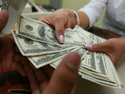 El tipo de cambio para solventar obligaciones en moneda extranjera pagaderas en la República Mexicana es de 13.4541 pesos. EL INFORMADOR / ARCHIVO