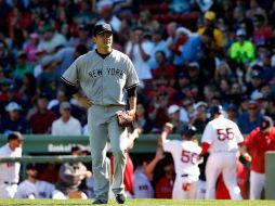 Tanaka permitió siete imparables, siete carreras, cinco limpias, en una entrada y dos tercios. Su salida más corta en su carrera. AFP / J. Rogash