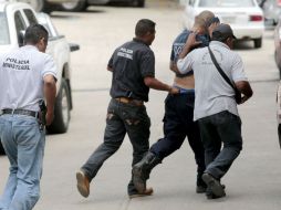 Se encuentran 22 policías detenidos para dar declaraciones sobre el siniestro. AFP / P.  Pardo