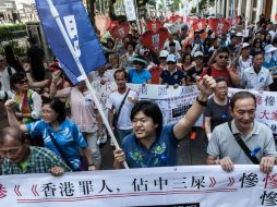 Estudiantes y activistas pro-democracia demandan que en China se celebren elecciones completas, libres y justas para 2017. AFP / A. Wallace