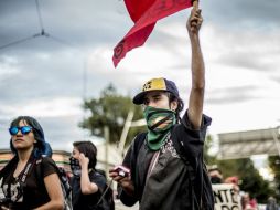 En la marcha homenaje al 2 de octubre, algunos grupos cometieron daños en la calle 5 de Mayo de la Ciudad de México. EL INFORMADOR / ARCHIVO