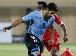 El seleccionado uruguayo asegura tener ganas de triunfar en el Barsa. AFP / M. Mahjoub