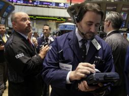 Los tres principales índices, Dow Jones, S&P 500 y Nasdaq, cierran la jornada al alza. AP / ARCHIVO