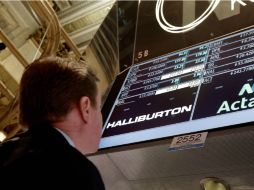 Los títulos bancarios, tecnológicos, industriales y de seguros, mostraban una baja de 4.71 puntos, -0.01 por ciento. AP / R. Drew