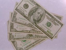 El tipo de cambio para solventar obligaciones en moneda extranjera pagaderas en la República Mexicana es de 13.6152 pesos. EL INFORMADOR / ARCHIVO