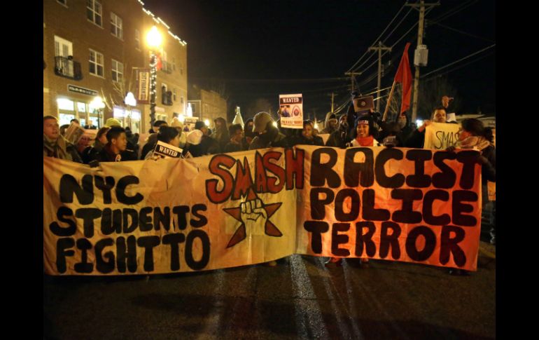 Diversas ciudades se unen a las protestas contra la decisión de no encausar al policía Darren Wilson. AP / J. Roberson