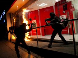 Durante la marcha en Paseo de la Reforma, bancos, restaurantes y tiendas de conveniencia sufrieron destrozos. SUN / ARCHIVO