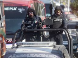 Las calles del puerto están resguardadas por elementos de seguridad de varios niveles. AFP / P. Pardo