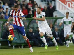 Un tanto de José Giménez y otro de Mario Mandzukic (en la foto, al frente) bastaron para derrumbar al Elche. EFE / Morell