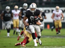 El ofensivo Mychal Rivera cierra el tanteador en el cuarto período. AFP / T. Henderson