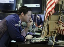El Dow Jones y el S&P500 tienen pérdidas, mientras que el índice compuesto de Nasdaq registra ganancias. AP / ARCHIVO