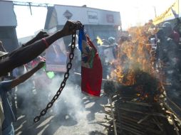 El país ha derivado en violentas protestas que piden la dimisión del presidente, Michel Martelly, y el primer ministro Laurent Lamothe. AFP / H. Retamal