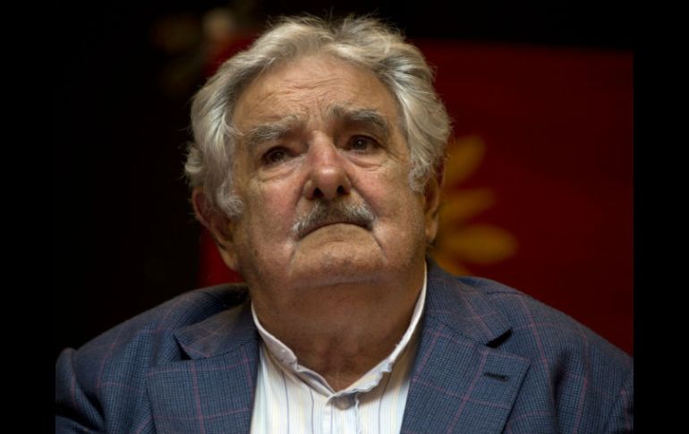 Durante su visita a Venezuela, José Mujica dice que le pidió a Nicolás Maduro que diera buen trato a sus prisioneros. AFP / P. Porciuncula