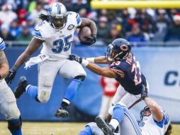 Joique Bell anota el touchdown de la ventaja gracias a una electrizante carrera en el cuarto final. AP / N. Huh