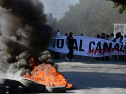 Cientos de campesinos que luchan por no ser desalojados de sus tierras. AFP / STR