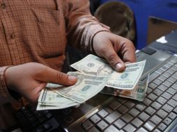 El tipo de cambio para solventar obligaciones en moneda extranjera pagaderas en el país es de 14.6955 pesos. EL INFORMADOR / ARCHIVO