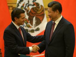 Peña Nieto (i) y Xi Jinping (d) han aplicado la estrategia basada en la apertura al exterior, lo que impulsa sus respectivas reformas. NTX / ARCHIVO