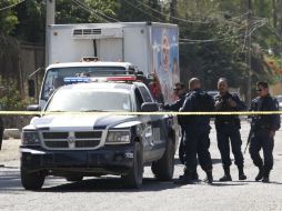 Personal del Ministerio Público y Servicios Periciales realiza las diligencias correspondientes en el lugar del asesinato. EL INFORMADOR / ARCHIVO