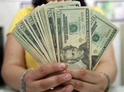 El tipo de cambio para solventar obligaciones en moneda extranjera pagaderas en el país es de 14.9024 pesos. EL INFORMADOR / ARCHIVO