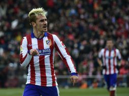 Antoine Griezmann celebra su anotación en esta goleada histórica del Atlético al Real Madrid. AFP / P. Marcou