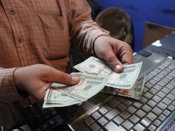 El tipo de cambio para solventar obligaciones en moneda extranjera pagaderas en el país es de 14.9309 pesos. EL INFORMADOR / ARCHIVO