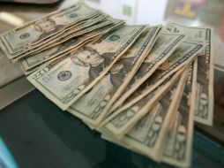 El tipo de cambio para solventar obligaciones en moneda extranjera pagaderas en el país es de 15.0757 pesos. EL INFORMADOR / ARCHIVO