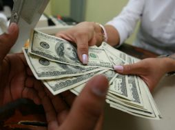 El tipo de cambio para solventar obligaciones en moneda extranjera en el país es de 14.9712 pesos. EL INFORMADOR / ARCHIVO