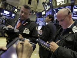 La tecnológica Nasdaq y el S&P cerraron con bajas mínimas. AP / R. Drew