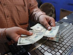 El Banco de México fija el tipo de cambio en 14.9624 para solventar obligaciones. EL INFORMADOR / ARCHIVO