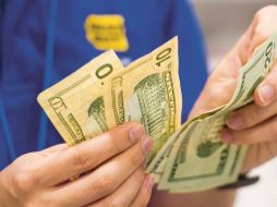 Dólares.Se impone al peso. Bloomberg  /