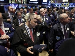 Luego de pasar la mayor parte de la jornada en verde, los índices se orientaron a la baja hacia el cierre. AP / R. Drew