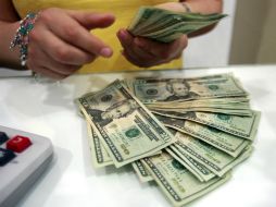 El tipo de cambio para solventar obligaciones en moneda extranjera se ubicó en 15.2427 pesos. EL INFORMADOR / ARCHIVO