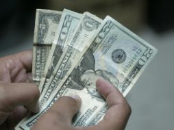 El Banxico precisó que el tipo de cambio para solventar obligaciones es de 14.9039 pesos. EL INFORMADOR / ARCHIVO