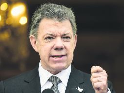 El presidente colombiano mandó mensaje a los jefes insurgentes a quienes les pidió escuchar 'el clamor nacional' de cesar la guerrilla. AFP /
