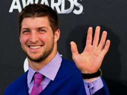 Tim es uno de los 68 jugadores en el equipo. AFP / ARCHIVO