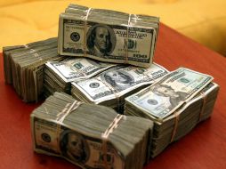 El tipo de cambio para solventar obligaciones es de 15.3213 pesos, informó el Banxico. EL INFORMADOR / ARCHIVO