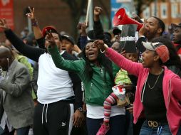 Ciudadanos de Baltimore se pronuncian en las calles a favor de la imputación de cargos a los elementos policiales. AFP / W. McNamee