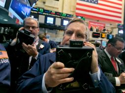 El Nasdaq, dominado por valores tecnológicos subió 11.54 puntos. AP / ARCHIVO