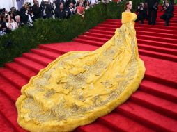 Llevaba una inmensa capa amarilla que le valió ser protagonista de varios memes. AFP / T. A. Clary