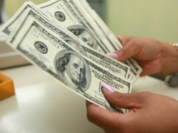 El tipo de cambio para solventar obligaciones en moneda extranjera es de 15.3225 pesos. EL INFORMADOR / ARCHIVO