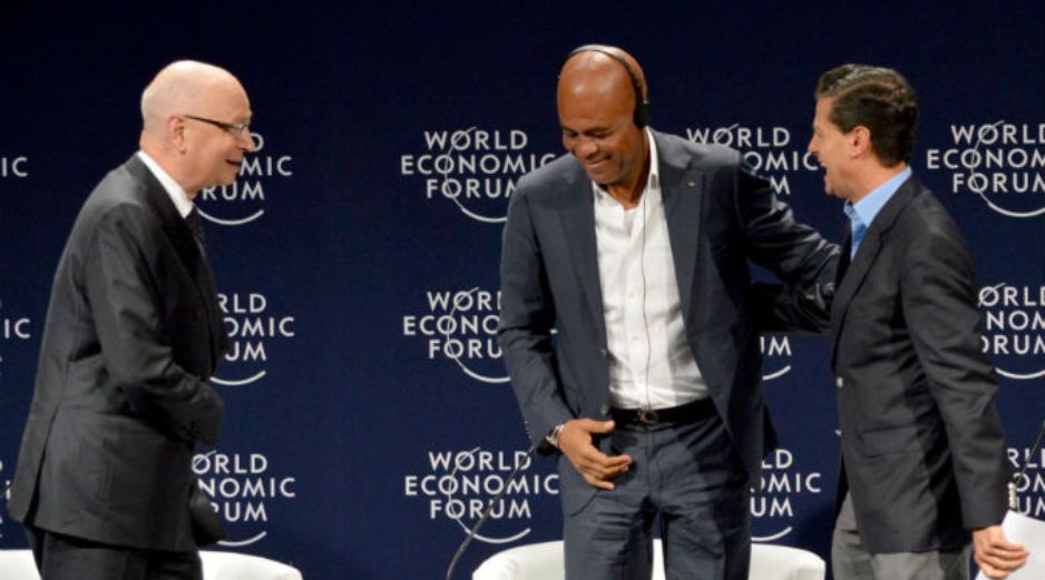 El fundador del WEF, Klaus Schwab, y los presidentes Michel Joseph Martelly, de Haití y Enrique Peña Nieto, de México. AFP / E. Ruiz