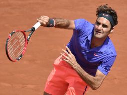 Roger finiquitó el encuentro al ganar cinco juegos consecutivos en el tercer set. AFP / P. Guyot